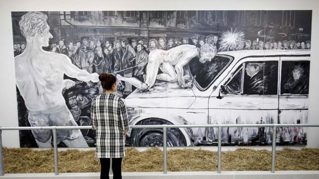 'Mad Dog' by Ukrainian-born Russian artist Oleg Kulik who lived as a “man-dog” in a belief that it embodied the period after the collapse of the Soviet Union. The London show, where each room is dedicated to a different artist, is curated by Marat Guelman. “We want to show an exhibition where the artist is important, not only the art,” he explained. (Tolga Akmen / AFP)
