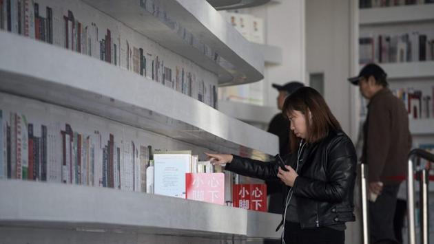 Pictures of the sleek Tianjin Binhai Library have gone viral on Chinese social media and abroad since it opened last month, with headlines calling it the “world’s best library” and a “book lover’s dream”. As a result, on weekends, an average of 15,000 visitors flock to the six-storey space in the eastern port city of Tianjin. (Fred Dufour / AFP) Pictures of the sleek Tianjin Binhai Library have gone viral on Chinese social media and abroad since it opened last month, with headlines calling it the “world’s best library” and a “book lover’s dream”. As a result, on weekends, an average of 15,000 visitors flock to the six-storey space in the eastern port city of Tianjin. (Fred Dufour / AFP)