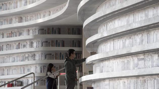 “We can only use the hall for the purposes for which it has been approved, so we cannot use it as a place to put books,” Liu laughed, hinting that the few books that remain on shelves might also be removed soon. The Binhai library’s viral image however has boosted readership, with checkouts quadrupling since the opening. (Fred Dufour / AFP) “We can only use the hall for the purposes for which it has been approved, so we cannot use it as a place to put books,” Liu laughed, hinting that the few books that remain on shelves might also be removed soon. The Binhai library’s viral image however has boosted readership, with checkouts quadrupling since the opening. (Fred Dufour / AFP)