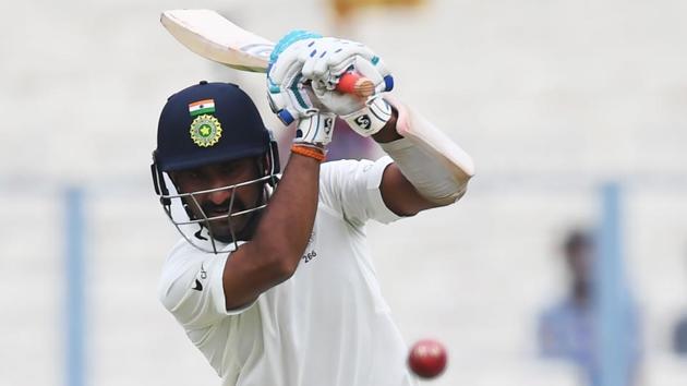India's Cheteshwar Pujara plays a shot during the second day of the first Test between India and Sri Lanka at the Eden Gardens cricket stadium in Kolkata on Friday. (AFP) India's Cheteshwar Pujara plays a shot during the second day of the first Test between India and Sri Lanka at the Eden Gardens cricket stadium in Kolkata on Friday. (AFP)
