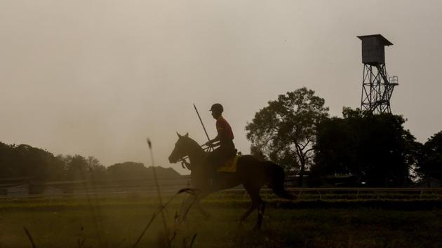 A horse rider practising tent pegging at the Southern Star Horse Show-2017 at Pune Race Course on Thursday. (Sanket Wankhade/HT PHOTO) 