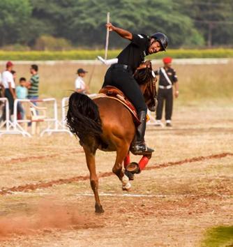 A participant of the tent pegging contingent in action during the Southern Star Horse Show-2017 at Pune Race Course on Thursday. (Sanket Wankhade/HT PHOTO) 