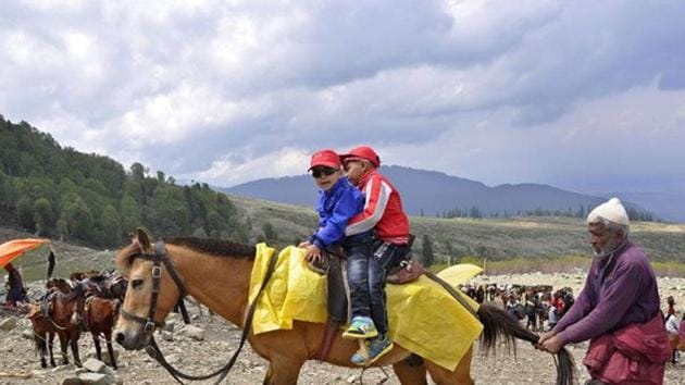 Kids enjoying a pony ride in Gulmarg. The MeT Department has forecast light rainfall or snow at isolated places in the state till Saturday. (HT File Photo) Kids enjoying a pony ride in Gulmarg. The MeT Department has forecast light rainfall or snow at isolated places in the state till Saturday. (HT File Photo)