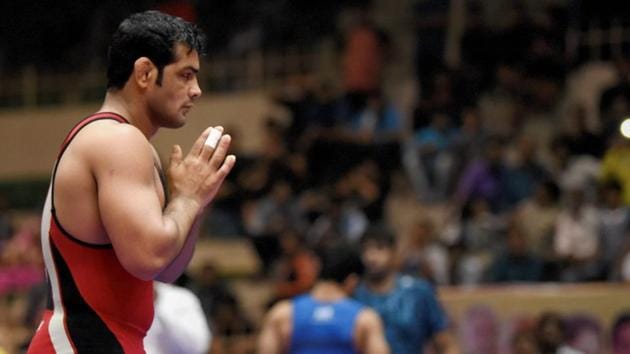 Wrestler Sushil Kumar greets the crowd after winning the gold medal in the men's 74kg freestyle competition during the Senior National wrestling championships in Indore on Friday.(PTI)