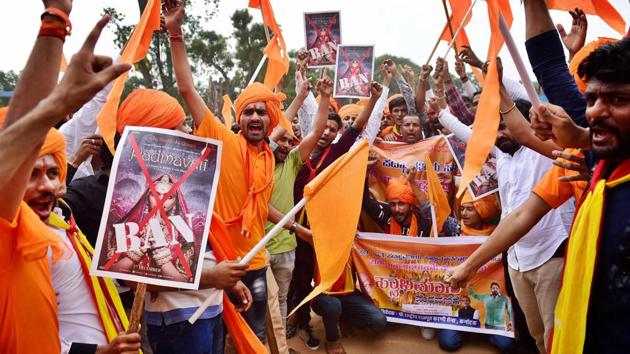 Members of Rashtriya Rajput Karni Sena shout slogans against fimmaker Sanjay Leela Bhansali during a protest demanding for a total ban on ‘Padmavati' at Freedom Park in Bengaluru. (PTI) Members of Rashtriya Rajput Karni Sena shout slogans against fimmaker Sanjay Leela Bhansali during a protest demanding for a total ban on ‘Padmavati' at Freedom Park in Bengaluru. (PTI)