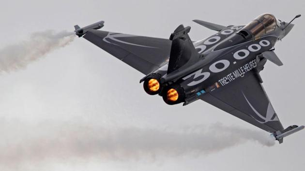 In this file photo, a Dassault Rafale fighter jet takes part in a flying display during the 49th Paris Air Show. In this file photo, a Dassault Rafale fighter jet takes part in a flying display during the 49th Paris Air Show.