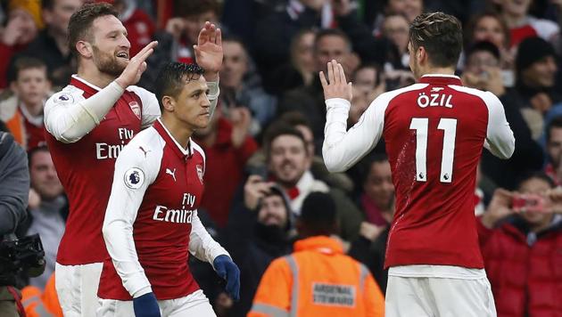 Arsenal's Shkodran Mustafi (L) celebrates scoring against Tottenham Hotspur in a Premier League match. (AFP) Arsenal's Shkodran Mustafi (L) celebrates scoring against Tottenham Hotspur in a Premier League match. (AFP)