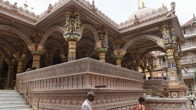 Devotees at the nearly 200 years old Swaminarayan Kalupur Temple in Ahmedabad. Ahmedabad hosts the towering Bhadra fort, the legendary stone latticework of the 16th-century Sidi Saiyyed mosque, and countless relics fusing Hindu and Muslim architectural styles of its conquerors. The heritage tag came despite warnings from some of UNESCO’s own experts that it lacked a convincing plan for protecting its ancient citadels, mosques and tombs. (Sam Panthaky / AFP) Devotees at the nearly 200 years old Swaminarayan Kalupur Temple in Ahmedabad. Ahmedabad hosts the towering Bhadra fort, the legendary stone latticework of the 16th-century Sidi Saiyyed mosque, and countless relics fusing Hindu and Muslim architectural styles of its conquerors. The heritage tag came despite warnings from some of UNESCO’s own experts that it lacked a convincing plan for protecting its ancient citadels, mosques and tombs. (Sam Panthaky / AFP)