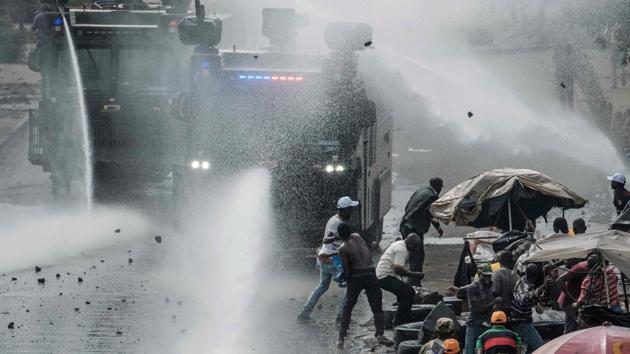Kenyan police clash with supporters of Kenyan's opposition party in Nairobi. The nullification of Kenya’s August election was the first time a court in Africa had overturned a presidential vote. At least 70 people have died in political unrest since then, the majority opposition demonstrators shot by police during protests. (Yasuyoshi Chiba / AFP)
