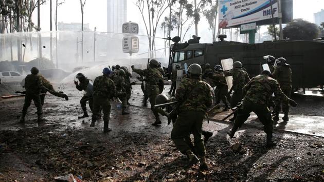 Riot police use stones to disperse the convoy of Kenyan opposition leader Raila Odinga of NASA coalition as they attempt to access the Uhuru Park grounds. Rights activists have condemned the police actions, accusing officers of taking sides in the political crisis and violating the constitution by preventing opposition supporters from assembling. (Thomas Mukoya / REUTERS)