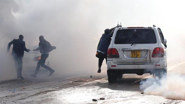 Politicians run after riot police fired tear-gas to disperse the convoy of Kenyan opposition leader Raila Odinga of the National Super Alliance coalition upon his return to Nairobi. At least 5 people have been killed so far in clashes between riot police and the supporters of opposition leader. Kenyan politics has been ripped with controversies after a repeat poll was ordered by the Supreme Court citing results of the August election, won by Kenyatta, with procedural irregularities. (Thomas Mukoya / REUTERS)