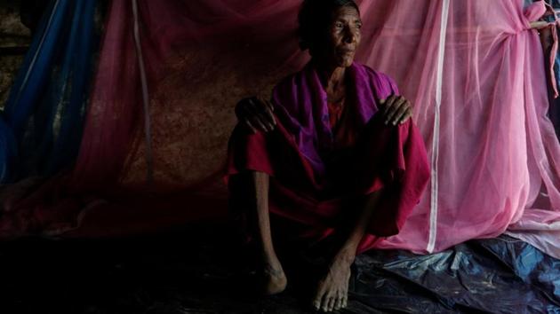 Kalabarow, 50 (above) said her husband, daughter and one son were killed when soldiers fired on her village in Maungdaw. She was hit in her right foot. She lay where she fell, pretending to be dead, for several hours before a grandson found her. During their 11-day journey to Bangladesh, a village doctor amputated her infected foot and four men carried her on a stretcher made of bamboo and a bed sheet. (Jorge Silva / REUTERS) Kalabarow, 50 (above) said her husband, daughter and one son were killed when soldiers fired on her village in Maungdaw. She was hit in her right foot. She lay where she fell, pretending to be dead, for several hours before a grandson found her. During their 11-day journey to Bangladesh, a village doctor amputated her infected foot and four men carried her on a stretcher made of bamboo and a bed sheet. (Jorge Silva / REUTERS)