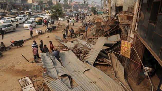 The drive lasted for seven to eight hours as locals tried to block the enforcement squad from carrying out its duty. (Parveen Kumar/HT Photo) The drive lasted for seven to eight hours as locals tried to block the enforcement squad from carrying out its duty. (Parveen Kumar/HT Photo)