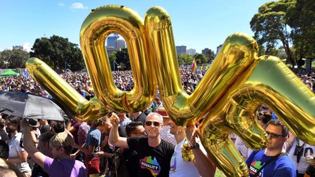 Supporters of the same-sex marriage ‘Yes’ vote gathered to celebrate the announcement in a Sydney park on November 15, 2017. Australians voted in favour of allowing same-sex couples to marry, official results showed on November 15, sending the task of legalising marriage equality to a deeply divided parliament. (WIlliam West / AFP) 