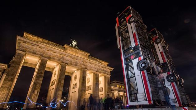 An installation made up of three upright buses, titled ‘Monument’ by Syrian-German artist Manaf Halbouni is displayed in front of the Brandenburg Gate in Berlin. On view till November 26 it recreates a picture taken in the rebel-held side of Aleppo in 2015 where three buses were upturned vertically to obstruct snipers and to keep people safe. (John Macdougall / AFP) 