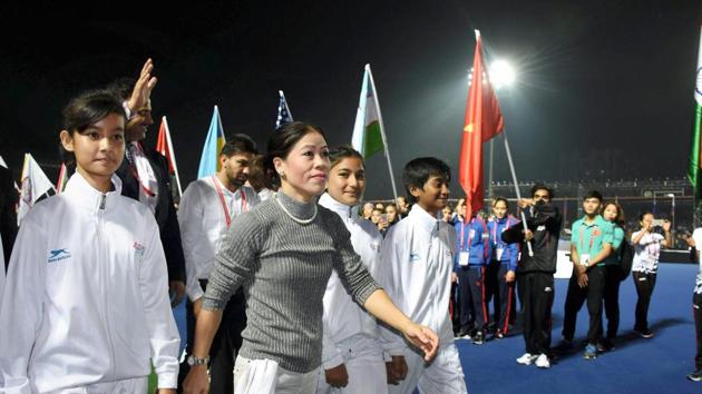 London Olympics medallist and multiple world champion MC Mary Kom with the Indian team boxers during the opening ceremony of the AIBA Youth Women’s World Boxing Championship in Guwahati on Sunday.(PTI)