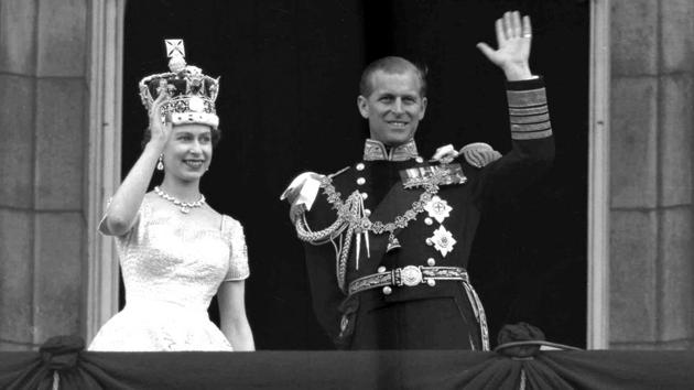 Queen Elizabeth II and Prince Philip, wave to supporters from the balcony at Buckingham Palace, following her coronation at Westminster Abbey. In the decades that followed, Philip spent almost the entire duration of their marriage supporting his wife in her role monarch. Both have cut back on public engagements in recent years, and Philip retired from official duties earlier this year. (Leslie Priest / AP) Queen Elizabeth II and Prince Philip, wave to supporters from the balcony at Buckingham Palace, following her coronation at Westminster Abbey. In the decades that followed, Philip spent almost the entire duration of their marriage supporting his wife in her role monarch. Both have cut back on public engagements in recent years, and Philip retired from official duties earlier this year. (Leslie Priest / AP)