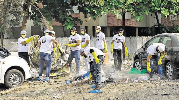 Initiative for peace and harmony (IPH), a non-profit charitable organisation started a cleanliness drive at Kausarbaug in Kondhwa in Pune on Sunday. (Rahul Raut/HT PHOTO) Initiative for peace and harmony (IPH), a non-profit charitable organisation started a cleanliness drive at Kausarbaug in Kondhwa in Pune on Sunday. (Rahul Raut/HT PHOTO)