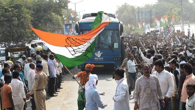 A Congress supporter waves party flag at Prantij town, some 65 kms from Ahmedabad on November 11, 2017. (AFP Photo) A Congress supporter waves party flag at Prantij town, some 65 kms from Ahmedabad on November 11, 2017. (AFP Photo)