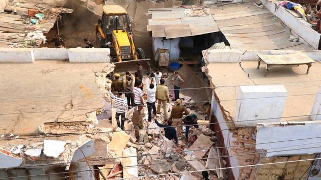 A day after an Argentinian national gored to death by a stray bull, Jaipur Muncipal Corporation official demolish illegal cowsheds in Jaipur on Sunday .(Vishal Bhatnagar/HT Photo.)