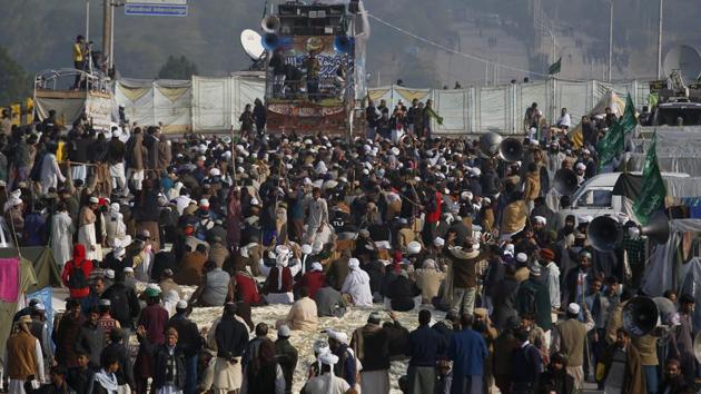 Supporters of Pakistani radical religious party shout slogans during a sit-in protest at an intersection of Islamabad, Pakistan. (AP) Supporters of Pakistani radical religious party shout slogans during a sit-in protest at an intersection of Islamabad, Pakistan. (AP)