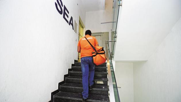A Grofers delivery executive on the job. (File photo) A Grofers delivery executive on the job. (File photo)