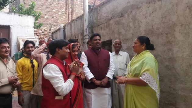 Raj Kishore Yadav (left) campaigning with Neha in Kanpur. (HT Photo) Raj Kishore Yadav (left) campaigning with Neha in Kanpur. (HT Photo)