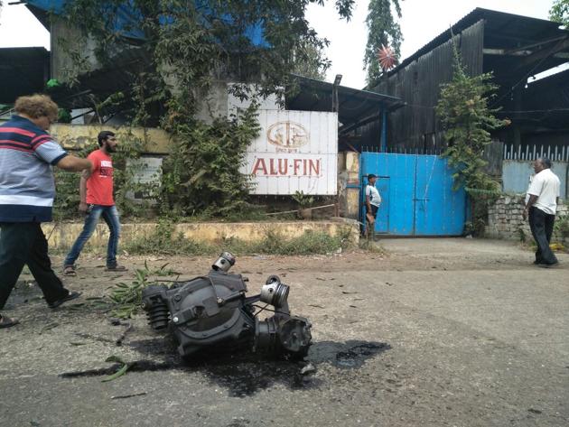 Parts of the compressor landed on the street outside, barely missing two bikers who were passing by. (Rishikesh Choudhary) Parts of the compressor landed on the street outside, barely missing two bikers who were passing by. (Rishikesh Choudhary)