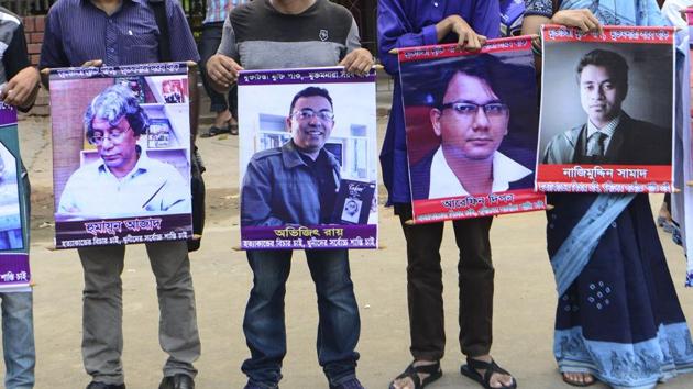 Bangladeshi activists hold the photos of activists, writers and bloggers - (L-R) Humayun Azad, Avijit Roy, Faisal Arefin Dipan, Nazimuddin Samad - who were murdered by unidentified assassins in the last few years, in Dhaka, on June 15, 2016. (AFP file) Bangladeshi activists hold the photos of activists, writers and bloggers - (L-R) Humayun Azad, Avijit Roy, Faisal Arefin Dipan, Nazimuddin Samad - who were murdered by unidentified assassins in the last few years, in Dhaka, on June 15, 2016. (AFP file)