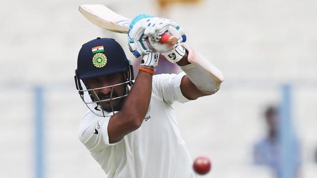 India's Cheteshwar Pujara plays a shot during the first Test between India and Sri Lanka at the Eden Gardens cricket stadium in Kolkata. (AFP) India's Cheteshwar Pujara plays a shot during the first Test between India and Sri Lanka at the Eden Gardens cricket stadium in Kolkata. (AFP)