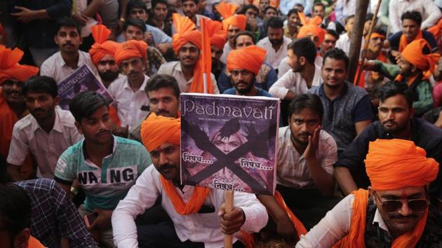 Members of Rajput groups hold placards as they protest against the release of Bollywood film Padmavati in Mumbai, India.(AP)