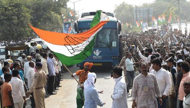 A Congress supporter waves party flag at Prantij town, some 65 kms from Ahmedabad on November 11, 2017. Elections in Gujarat will be held in two phases on December 9 and 14. (AFP Photo) A Congress supporter waves party flag at Prantij town, some 65 kms from Ahmedabad on November 11, 2017. Elections in Gujarat will be held in two phases on December 9 and 14. (AFP Photo)
