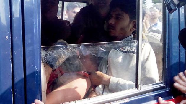 Police rush Devpal to hospital, in Ramnagar on Monday. (HT Photo) Police rush Devpal to hospital, in Ramnagar on Monday. (HT Photo)
