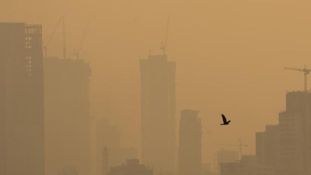 A bird flies over smoggy skyline of Mumbai. (Pratik Chorge/HT) A bird flies over smoggy skyline of Mumbai. (Pratik Chorge/HT)