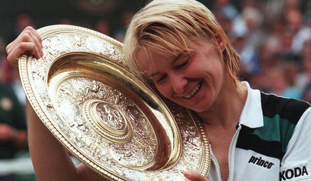 An old photo of Jana Novotna shows her enjoying Wimbledon women’s singles triumph in 1998. She died at 49 on Monday after suffering from cancer. (AFP)