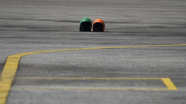 The helmets of two members of the Tornadoes team who were not able to participate in the third and eventually successful run are seen on the track. One was injured during a failed attempt and the other failed to board during the final attempt bringing the eventual number down to 58. (Arijit Sen / HT Photo) The helmets of two members of the Tornadoes team who were not able to participate in the third and eventually successful run are seen on the track. One was injured during a failed attempt and the other failed to board during the final attempt bringing the eventual number down to 58. (Arijit Sen / HT Photo)