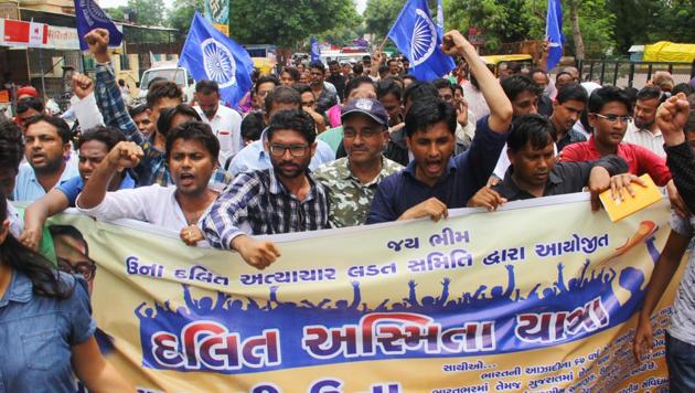 Dalits shout slogans during a protest march from Ahmedabad to Una where four from the community were brutally beaten by alleged vigilantes for skinning a dead cow, in Gujarat’s Ahmedabad, in August 2016. (Siddharaj Solanki/HTFile PHoto) Dalits shout slogans during a protest march from Ahmedabad to Una where four from the community were brutally beaten by alleged vigilantes for skinning a dead cow, in Gujarat’s Ahmedabad, in August 2016. (Siddharaj Solanki/HTFile PHoto)