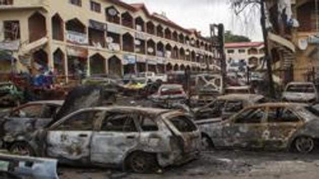 File photo of the scene of a bombing at Emab business centre, filled with the wreckage of burnt cars, in the business district of Abuja on June 26, 2014. chi(Reuters)