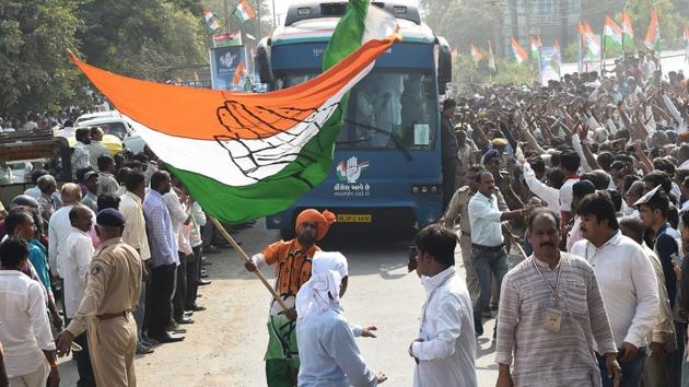 A Congress supporter waves the party flag at Prantij town, some 65 kms from Ahmedabad on November 11, 2017. (AFP Photo) A Congress supporter waves the party flag at Prantij town, some 65 kms from Ahmedabad on November 11, 2017. (AFP Photo)