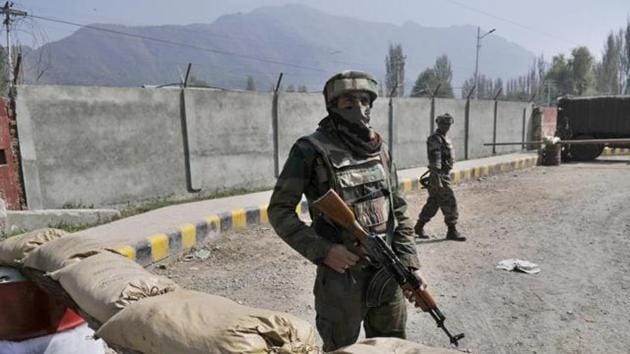 An Indian Army soldier stands guard near a check post in Srinagar.(HT File)