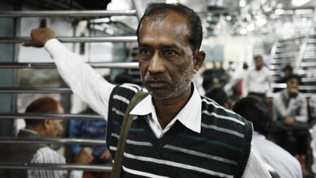 With slums, skyscrapers, monuments, rocks, dense forest, parks and tree-lined avenues visible through the large open coaches, a journey in the suburban train provides an alternative view of the city. For many that is reason enough for the government to revive it.  (Vipin Kumar / HT Photo) 