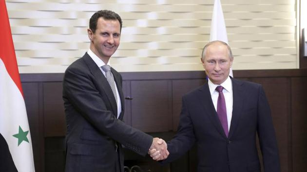Russian President Vladimir Putin (R) shakes hands with Syrian President Bashar al-Assad during a meeting in the Black Sea resort of Sochi, Russia, on Monday. (REUTERS) Russian President Vladimir Putin (R) shakes hands with Syrian President Bashar al-Assad during a meeting in the Black Sea resort of Sochi, Russia, on Monday. (REUTERS)
