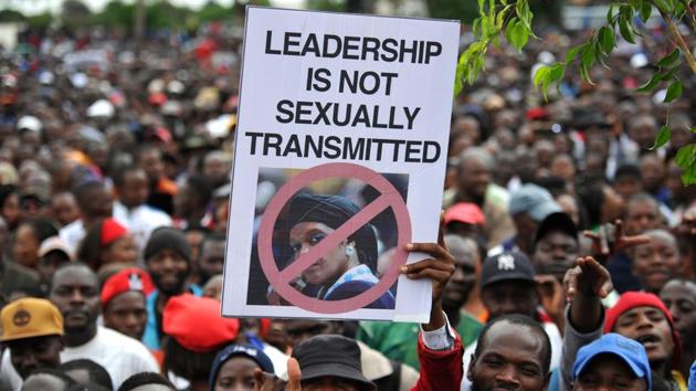 People hold an anti-Grace Mugabe placard during a demonstration demanding Mugabe’s resignation on November 18, 2017 in Harare. In a draft impeachment motion, ZANU-PF said Mugabe had abused his constitutional mandate to favour his wife Grace, 52, whose tilt at power triggered the backlash from the army. (Zinyange Auntony / AFP) People hold an anti-Grace Mugabe placard during a demonstration demanding Mugabe’s resignation on November 18, 2017 in Harare. In a draft impeachment motion, ZANU-PF said Mugabe had abused his constitutional mandate to favour his wife Grace, 52, whose tilt at power triggered the backlash from the army. (Zinyange Auntony / AFP)