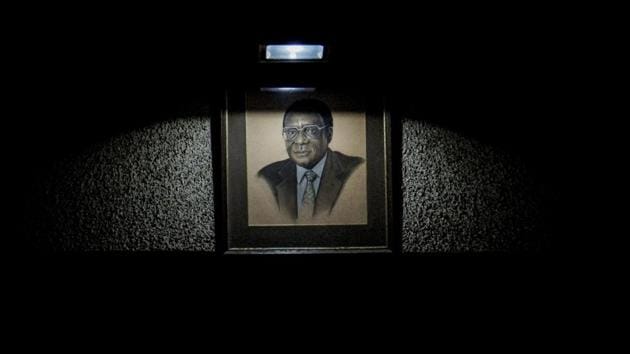 A portrait of Zimbabwe’s President Mugabe hangs in the ZANU-PF hall where delegates at a special ZANU-PF party Central Committee at the party’s headquarters sacked him from party leadership and expelled his wife Grace Mugabe on November 19, 2017 in Harare. (Zinyange Auntony / AFP) A portrait of Zimbabwe’s President Mugabe hangs in the ZANU-PF hall where delegates at a special ZANU-PF party Central Committee at the party’s headquarters sacked him from party leadership and expelled his wife Grace Mugabe on November 19, 2017 in Harare. (Zinyange Auntony / AFP)