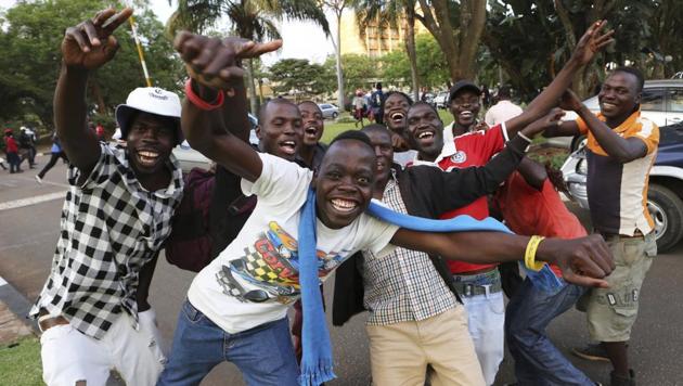Zimbabweans celebrate after Robert Mugabe resigned as Zimbabwe’s president on Tuesday a week after the army and his former political allies moved against him, ending four decades of rule by a man who turned from independence hero to archetypal African strongman. (Tsvangirayi Mukwazhi / AP) Zimbabweans celebrate after Robert Mugabe resigned as Zimbabwe’s president on Tuesday a week after the army and his former political allies moved against him, ending four decades of rule by a man who turned from independence hero to archetypal African strongman. (Tsvangirayi Mukwazhi / AP)