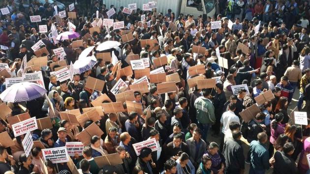 Nagaland government employees staged a rally in Kohima on Tuesday seeking withdrawal of cases filed against their colleagues by the National Investigation Agency (HT Photo) Nagaland government employees staged a rally in Kohima on Tuesday seeking withdrawal of cases filed against their colleagues by the National Investigation Agency (HT Photo)