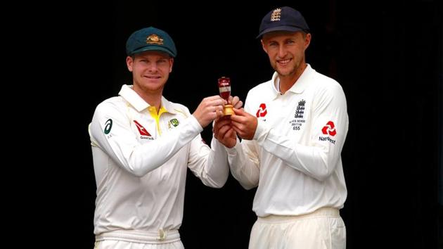 Australian cricket team captain Steve Smith holds a replica of the Ashes urn with England skipper Joe Root during an official event ahead of the opening Test at the Gabba in Brisbane on Wednesday. (Reuters) Australian cricket team captain Steve Smith holds a replica of the Ashes urn with England skipper Joe Root during an official event ahead of the opening Test at the Gabba in Brisbane on Wednesday. (Reuters)