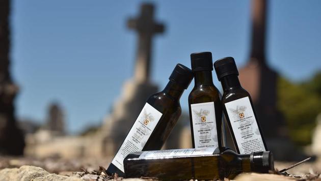 The last bottles of 2017’s limited-edition olive oil, released to mark the 180th anniversary of the West Terrace Cemetery in Adelaide. From the graveside to the dinner plate, olive oil harvested from centuries-old trees at an Australian cemetery is just the latest by Australian authorities in a bid to shake up people’s attitudes towards death and burial sites. (Peter Park / AFP) The last bottles of 2017’s limited-edition olive oil, released to mark the 180th anniversary of the West Terrace Cemetery in Adelaide. From the graveside to the dinner plate, olive oil harvested from centuries-old trees at an Australian cemetery is just the latest by Australian authorities in a bid to shake up people’s attitudes towards death and burial sites. (Peter Park / AFP)