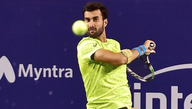 Indian tennis player Yuki Bhambri plays against Pedro Martinez of Spain during the Bengaluru Open 2017 ATP Challenger at KSLTA on Wednesday.. (PTI) Indian tennis player Yuki Bhambri plays against Pedro Martinez of Spain during the Bengaluru Open 2017 ATP Challenger at KSLTA on Wednesday.. (PTI)