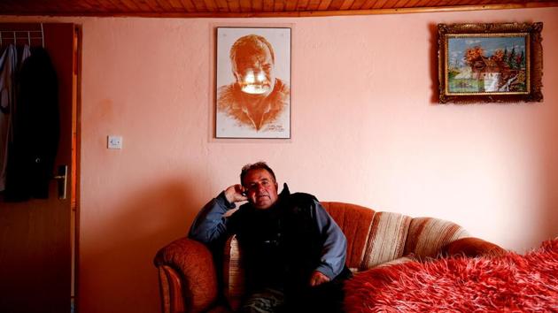 Dusko Mladic, at his house in the village where Ratko Mladic was born. A portrait of him now hangs on a wall. "He [Ratko Mladic] did not kill people. During the war he gathered our Muslim neighbours from a nearby village and warned them in time to leave," said Dusko. (Dado Ruvic / REUTERS) 